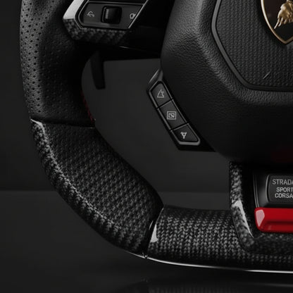 Steering wheel with Lamborghini logo on a dark background