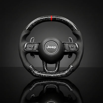 Carbon fiber JEEP WRANGLER steering wheel on a reflective surface with a dark background