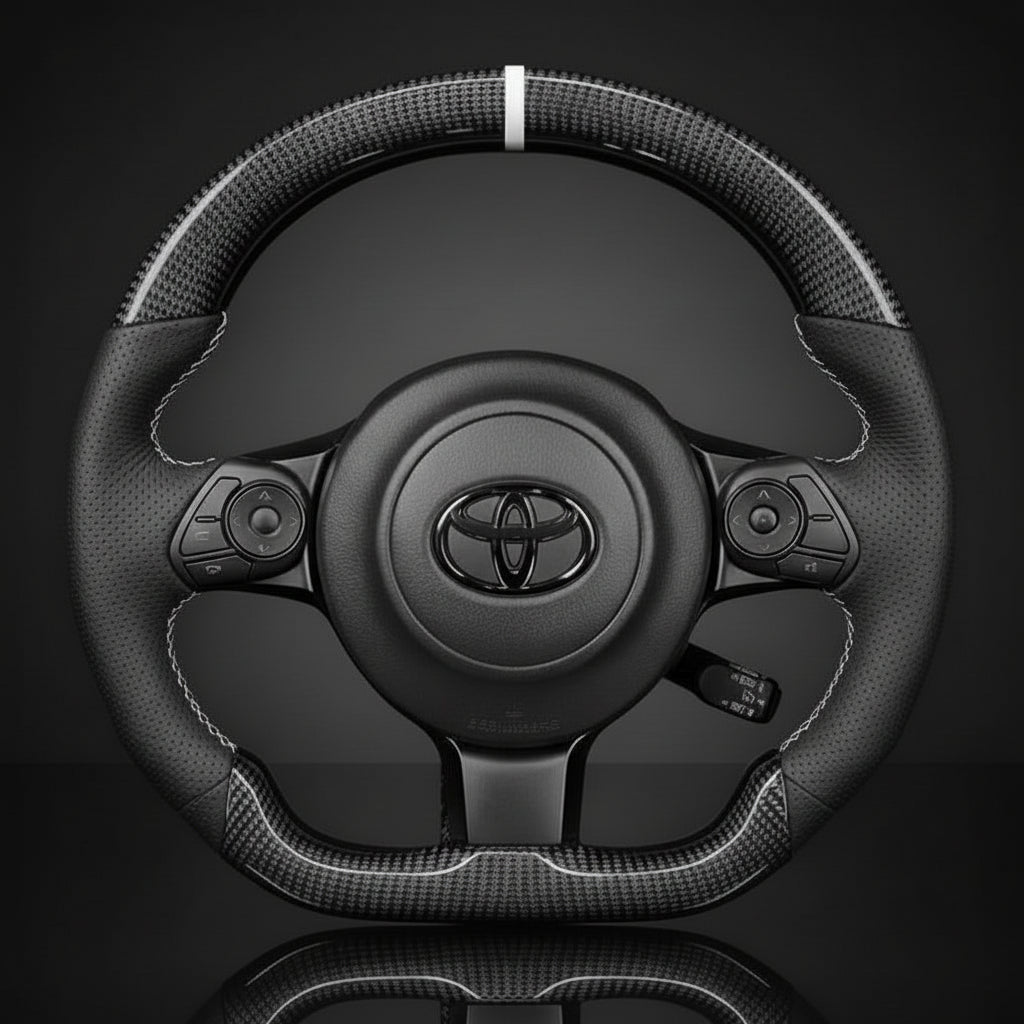 Carbon Fiber steering wheel with Toyota logo on a dark background